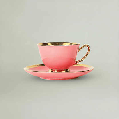 Blush pink porcelain tea cup and saucer with gold accents