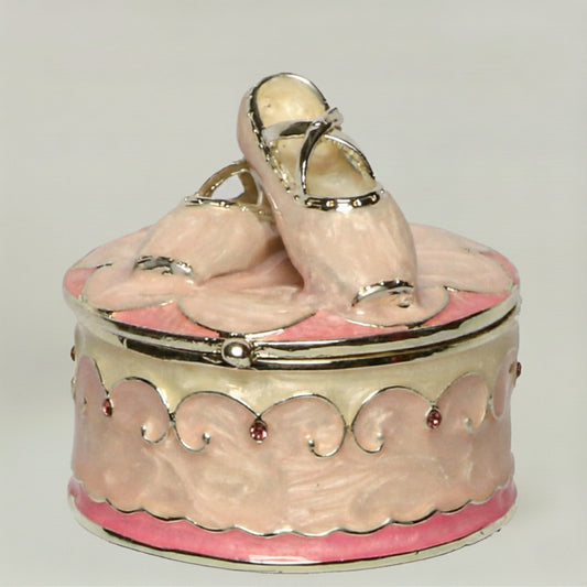 Baby keepsake trinket box with ballerina slippers design in pink and cream enamel, decorative nursery keepsake storage for baby girl jewellery and first memories.