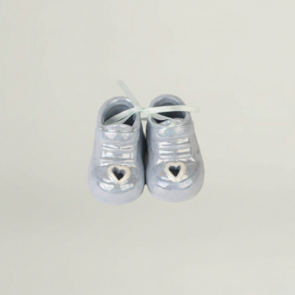 Ceramic baby shoes keepsake in pastel blue – elegant decorative element for newborn luxury gift hamper.