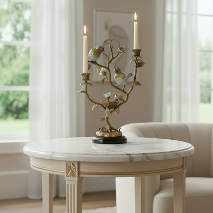 Decorative bird candle stand with branching gold design and twin candles, styled on a marble table for refined luxury home décor.