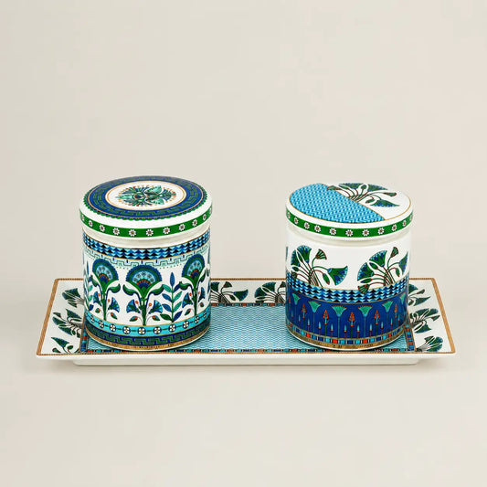 Two premium decorative ceramic canisters placed neatly on a matching long rectangular serving tray.