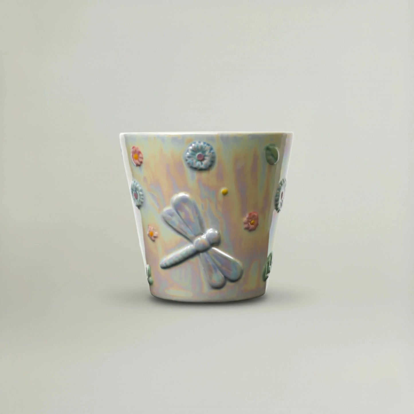 Small Dragonfly Planter in iridescent ceramic finish with pastel floral details, decorative mini planter for succulents and tabletop home décor.