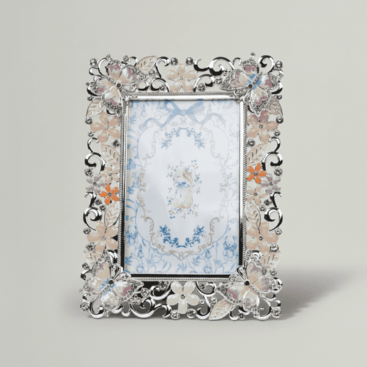 Decorative photo frame with floral design on a light gray background