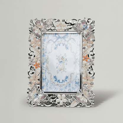 Decorative photo frame with floral design on a light gray background