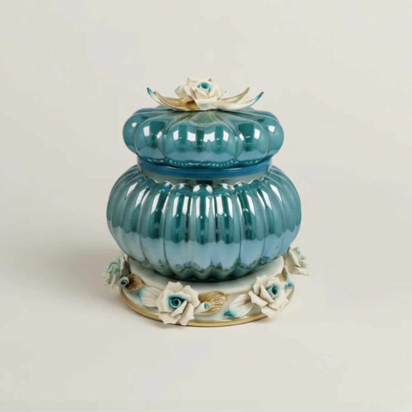 Azzure Cresta luxury blue floral decorative jar by Fleur De Lis with ribbed design, sculpted roses, gold accents, and rounded lidded form.