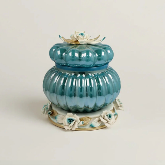 Azzure Cresta luxury blue floral decorative jar by Fleur De Lis with ribbed design, sculpted roses, gold accents, and rounded lidded form.