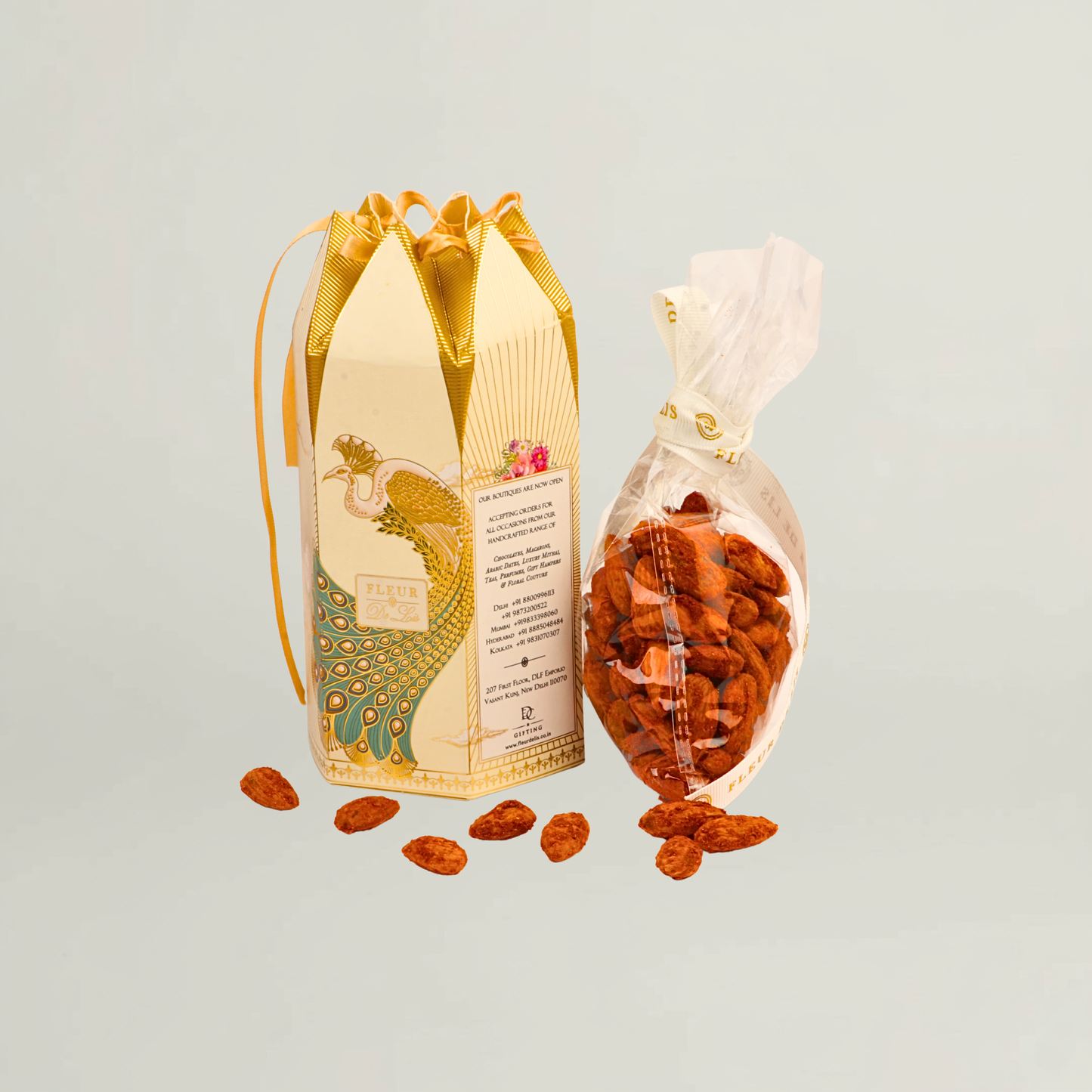 Fleur de Lis gourmet almonds presented in elegant premium packaging, styled for luxury gifting and festive occasions.