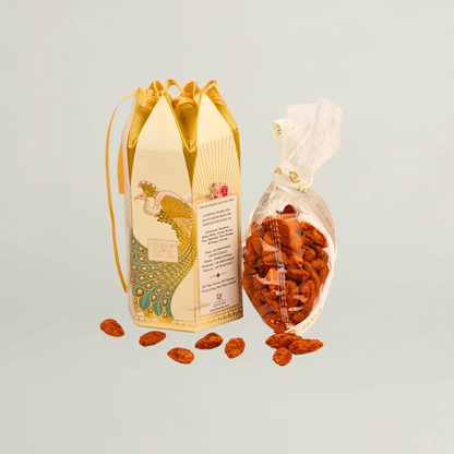 Fleur de Lis gourmet almonds presented in elegant premium packaging, styled for luxury gifting and festive occasions.