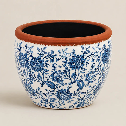 Large decorative ceramic planter with blue botanical artwork and terracotta finish.