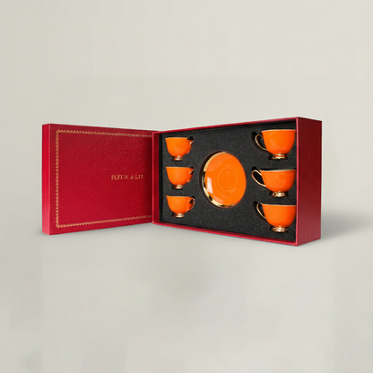 Orange tea cup and saucer set presented in luxury Fleur de Lis gift box