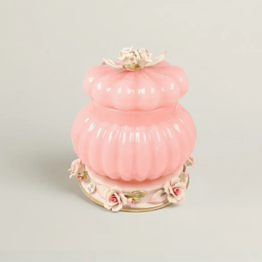 Pink Cresta luxury floral decorative jar by Fleur De Lis in blush pink with ribbed design, sculpted roses, and gold accents, shown closed.