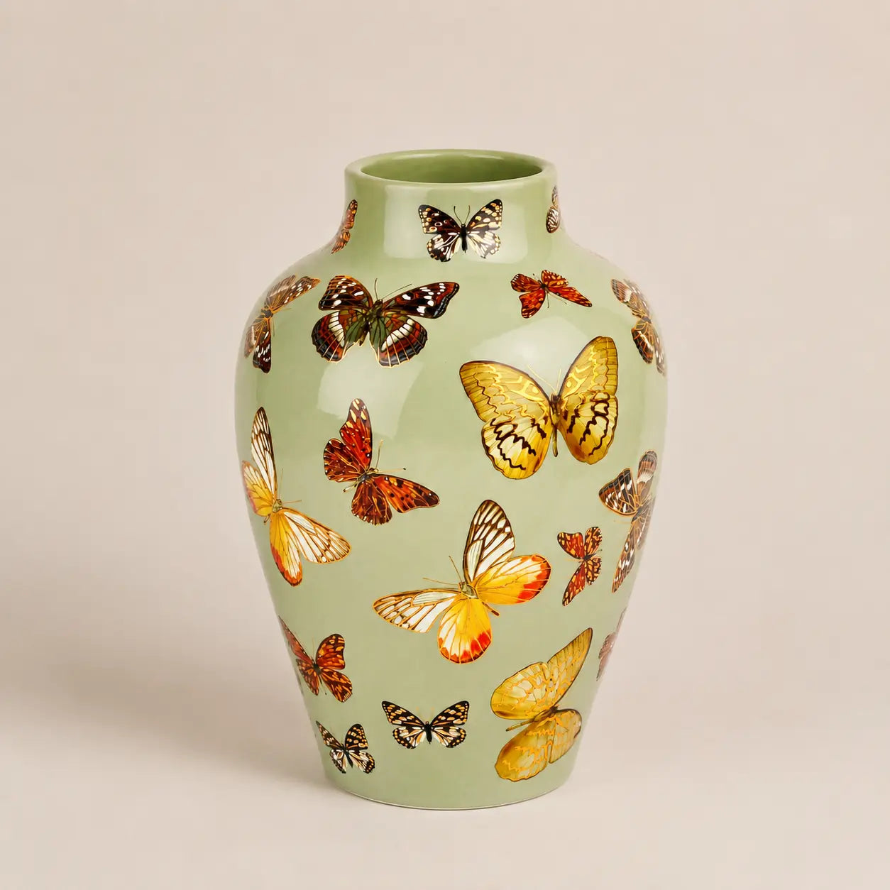 Fleur de Lis sage green vase featuring detailed butterfly motifs.