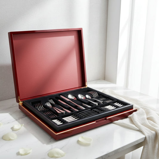 Sottile luxury cutlery set by Fleur De Lis styled in a refined interior, showcasing mirror-finish stainless steel flatware in a premium wooden presentation box.