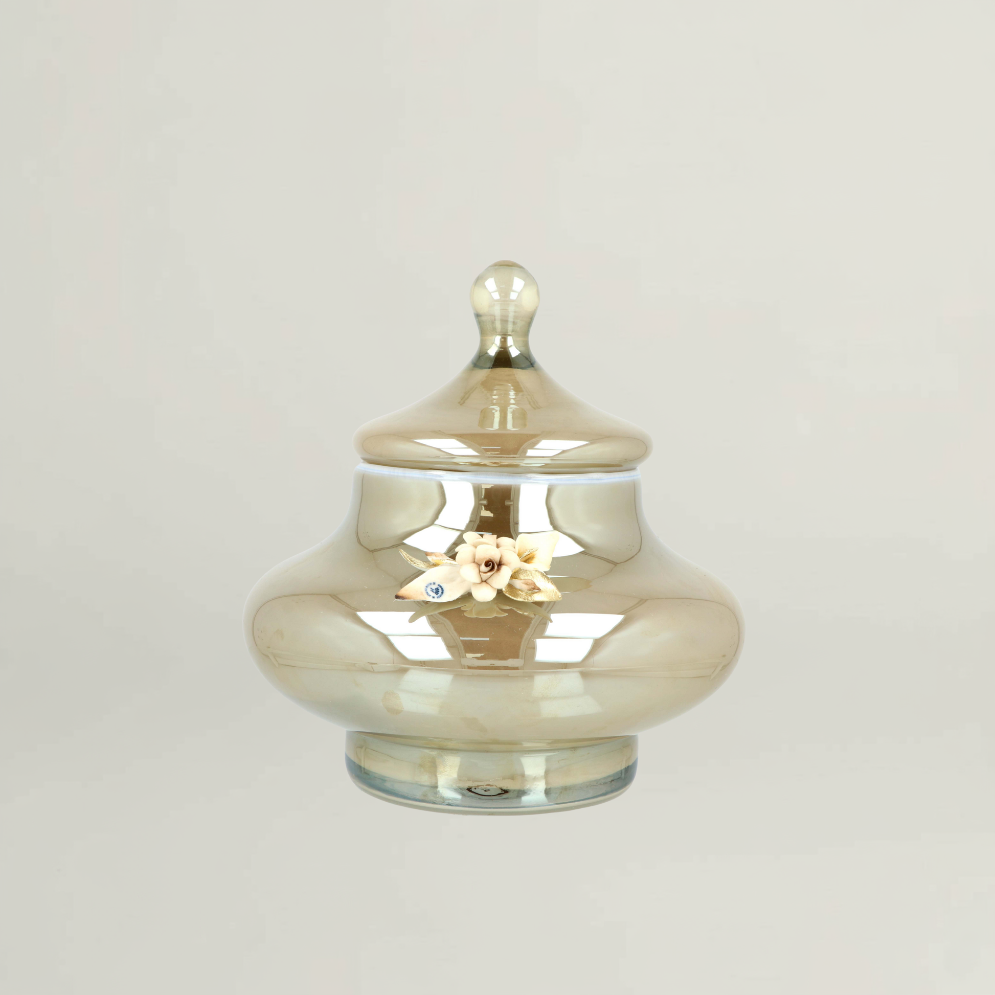 Splendor luxury amber floral decorative jar by Fleur De Lis with smooth rounded form, reflective glass finish, and sculpted floral accent.