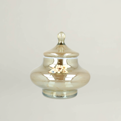 Splendor luxury amber floral decorative jar by Fleur De Lis with smooth rounded form, reflective glass finish, and sculpted floral accent.