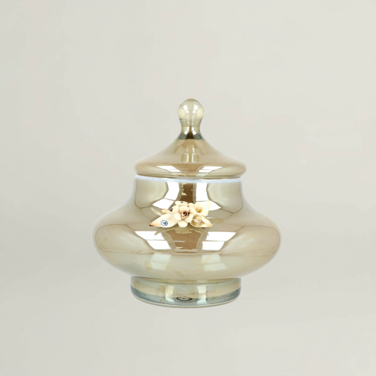 Splendor luxury amber floral decorative jar by Fleur De Lis with smooth rounded form, reflective glass finish, and sculpted floral accent.