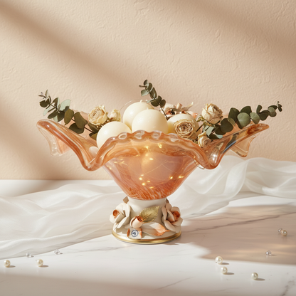 Tangerine Ripple centerpiece bowl by Fleur De Lis styled as luxury table décor, showcasing an amber ruffled glass bowl with floral detailing.