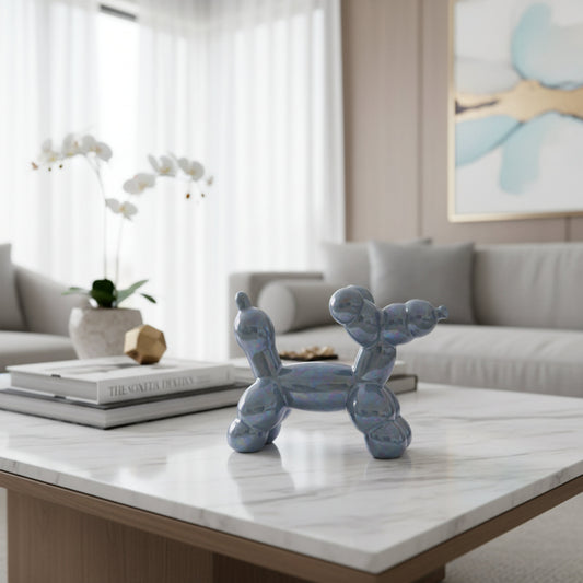 Iridescent blue ceramic balloon dog sculpture styled on a modern living room table, contemporary home decor accent and artistic desk ornament