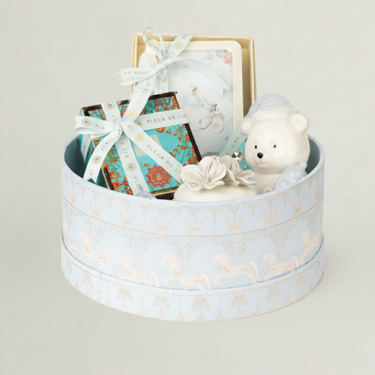 Kids luxury gift hamper in pastel blue keepsake box with ceramic teddy bear, baby frame, chocolates and baby keepsakes – premium newborn gift hamper.