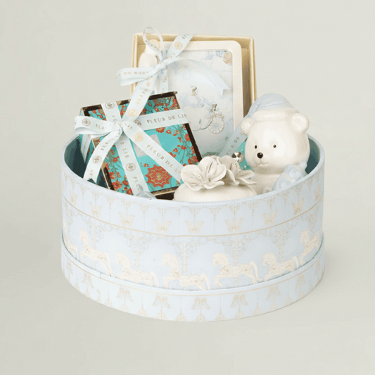 Kids luxury gift hamper in pastel blue keepsake box with ceramic teddy bear, baby frame, chocolates and baby keepsakes – premium newborn gift hamper.