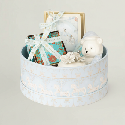 Kids luxury gift hamper in pastel blue keepsake box with ceramic teddy bear, baby frame, chocolates and baby keepsakes – premium newborn gift hamper.