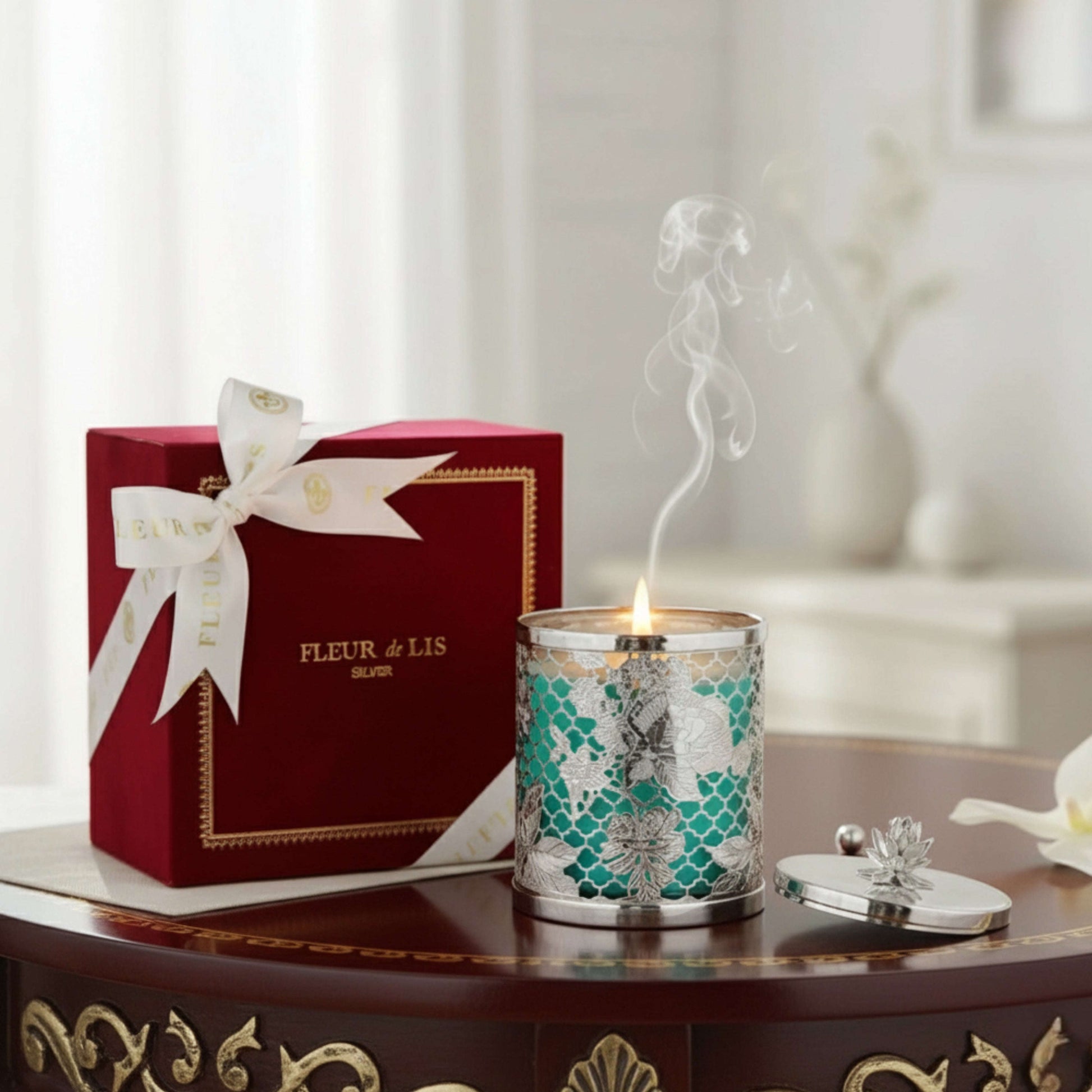 Candle with decorative box on a table