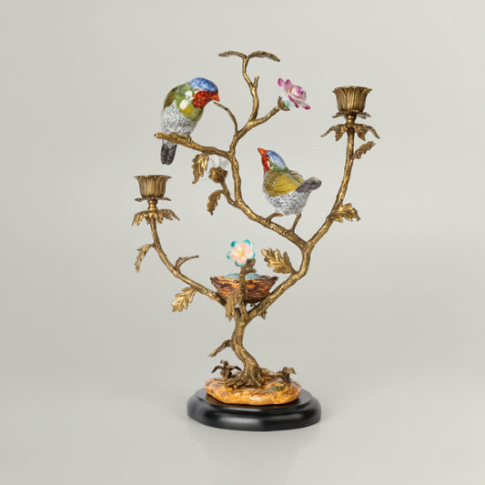 Luxury decorative candle holder featuring sculpted birds on a branching design with antique gold finish, ideal for elegant home décor.