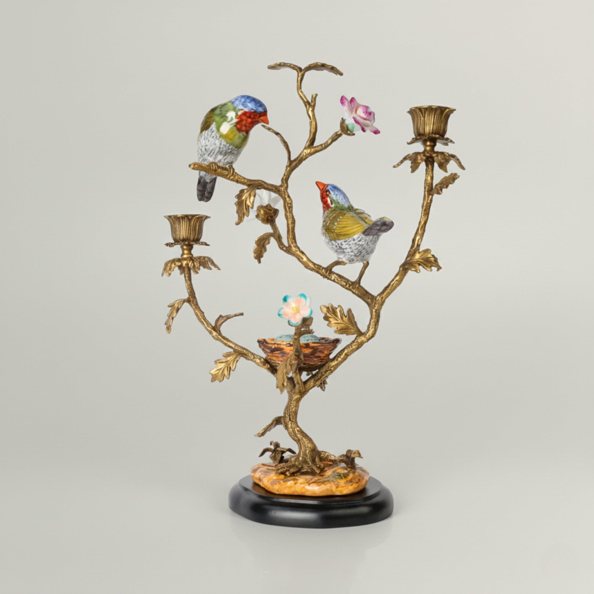 Luxury decorative candle holder featuring sculpted birds on a branching design with antique gold finish, ideal for elegant home décor.