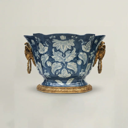 Luxury blue ceramic decorative bowl with intricate floral pattern, antique gold handles, and pedestal base for elegant home décor.