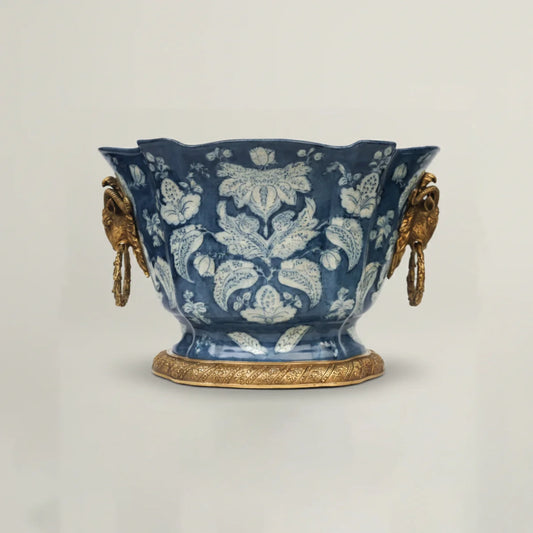 Luxury blue ceramic decorative bowl with intricate floral pattern, antique gold handles, and pedestal base for elegant home décor.