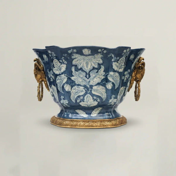 Luxury blue ceramic decorative bowl with intricate floral pattern, antique gold handles, and pedestal base for elegant home décor.