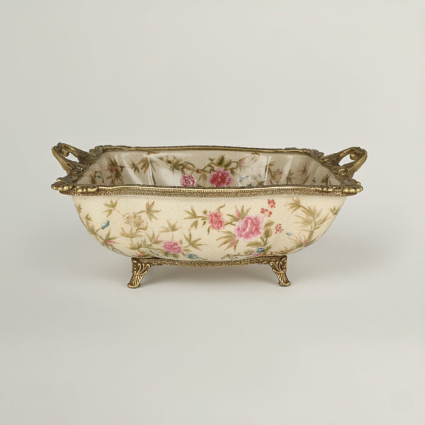 Luxury ceramic decorative bowl with hand-painted floral motifs, antique gold handles, and raised feet, ideal for elegant home décor.