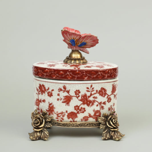 Luxury ceramic storage box with red floral detailing, gold accents, and decorative butterfly lid, ideal for premium home décor and gifting.