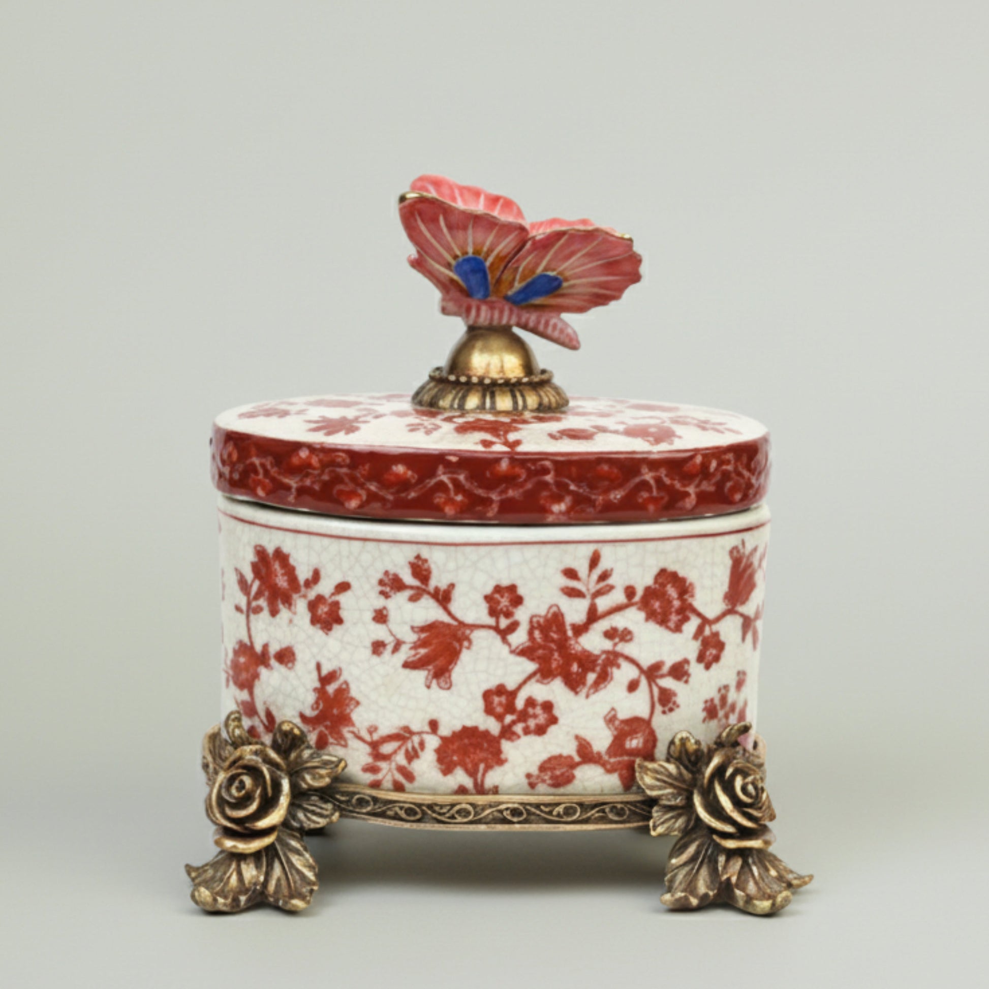 Luxury ceramic storage box with red floral detailing, gold accents, and decorative butterfly lid, ideal for premium home décor and gifting.