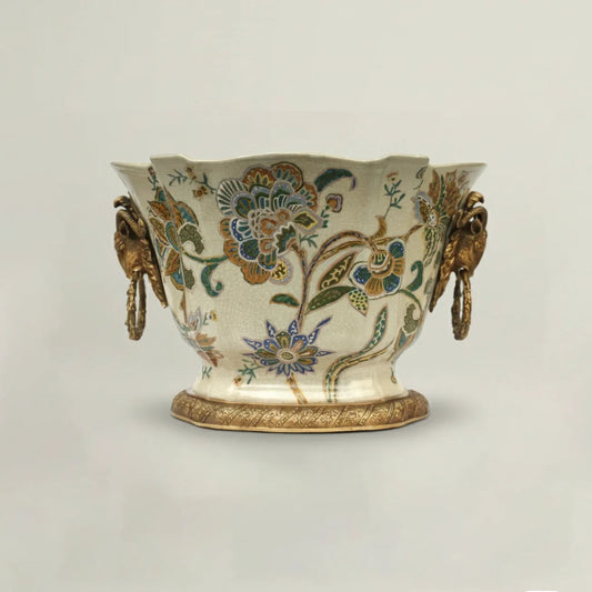 Luxury cream ceramic decorative bowl with intricate hand-painted floral motifs, antique gold handles, and pedestal base for elegant home décor.
