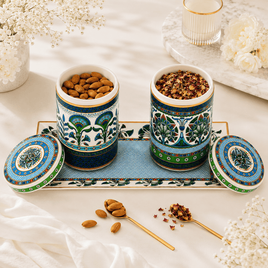 Luxury ceramic canister set with tray styled with almonds and herbal tea.