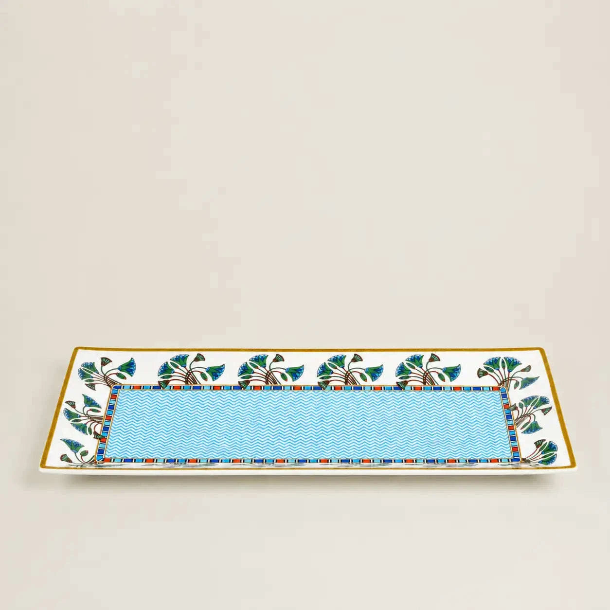 Rectangular ceramic serving platter featuring a turquoise chevron pattern and an elegant botanical border.
