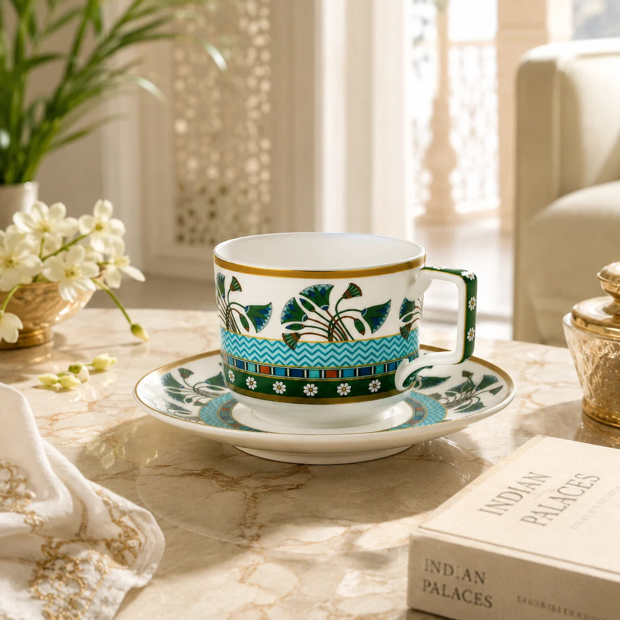 Elegant porcelain teacup and saucer styled in a refined Indian-inspired home setting.