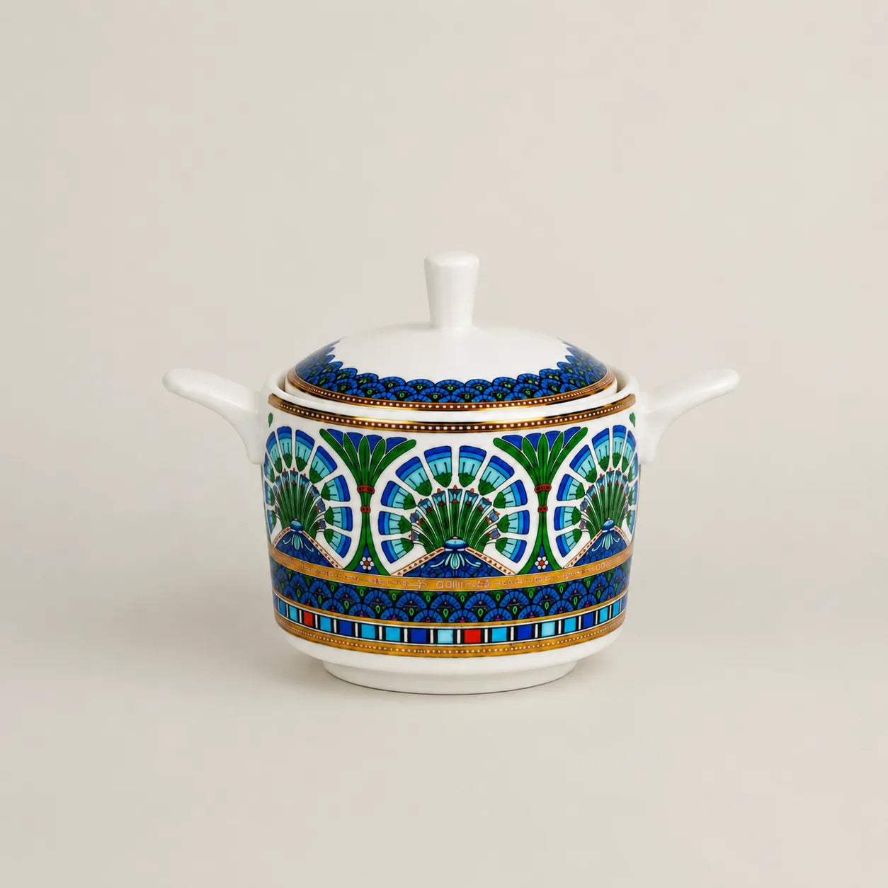Luxury porcelain sugar bowl with lid and intricate blue-green floral patterns.