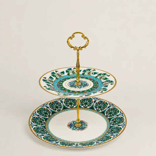 Luxury Mediterranean porcelain two-tier serving stand with gold handle and floral motifs.