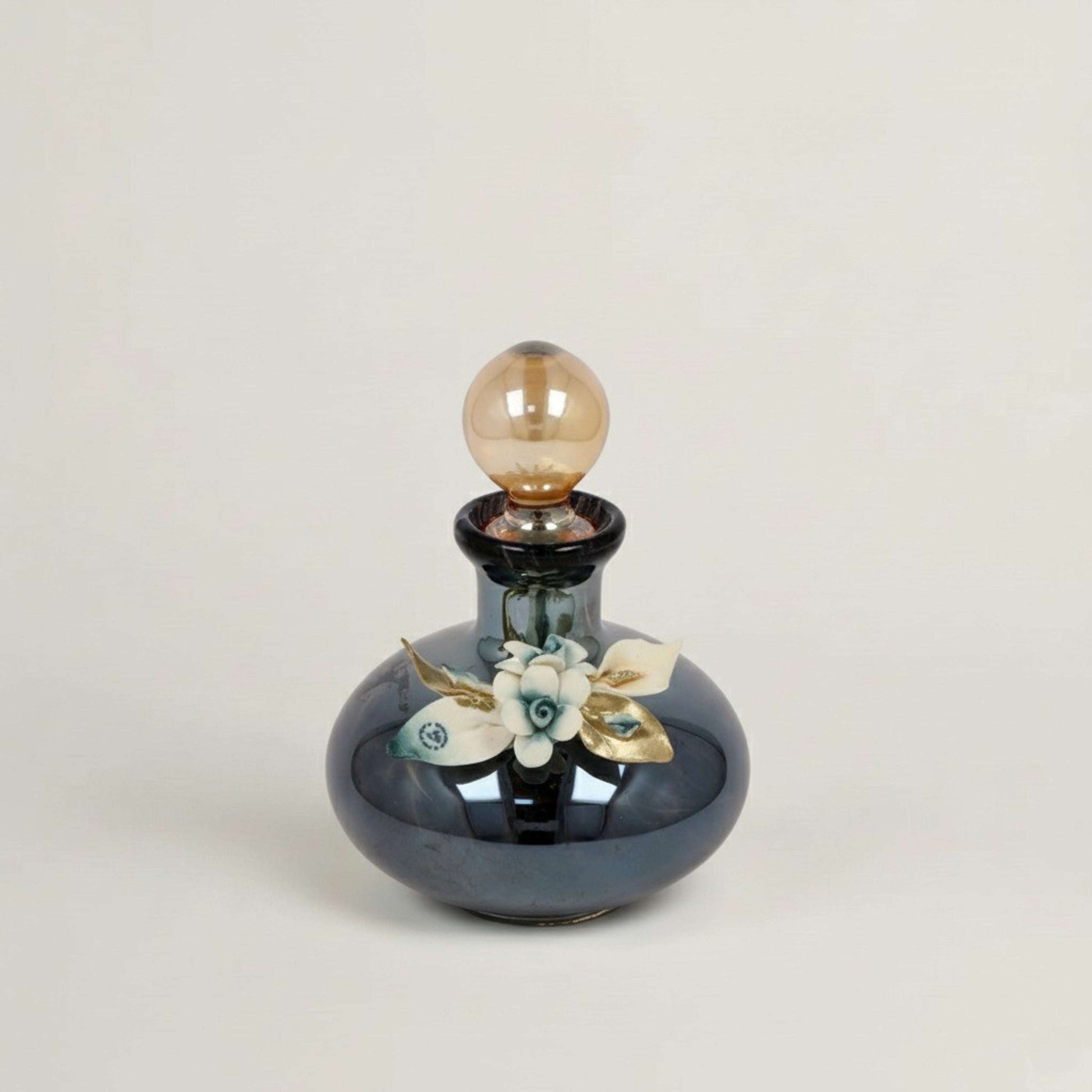 Handcrafted Onyx Murano black crystal perfume bottle with white, blue and gold floral detailing by Fleur De Lis