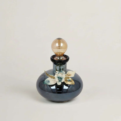 Handcrafted Onyx Murano black crystal perfume bottle with white, blue and gold floral detailing by Fleur De Lis