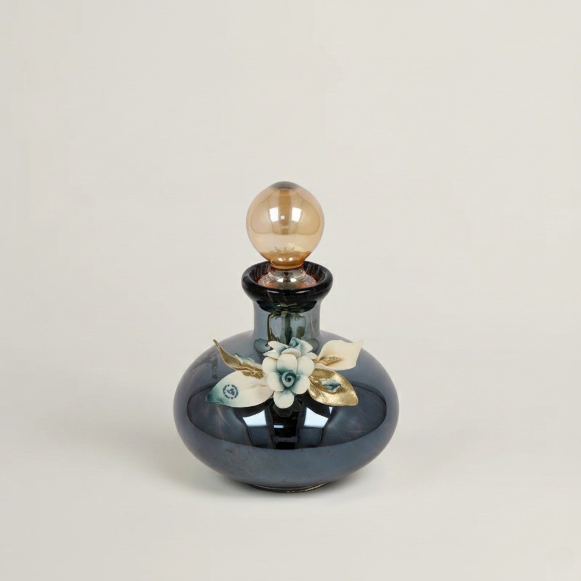 Handcrafted Onyx Murano black crystal perfume bottle with white, blue and gold floral detailing by Fleur De Lis