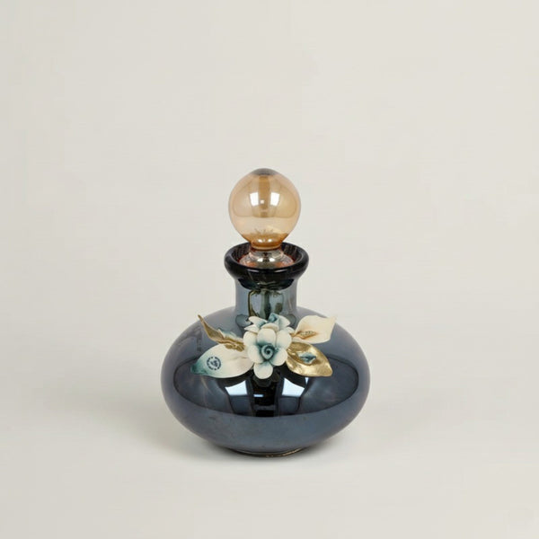 Handcrafted Onyx Murano black crystal perfume bottle with white, blue and gold floral detailing by Fleur De Lis