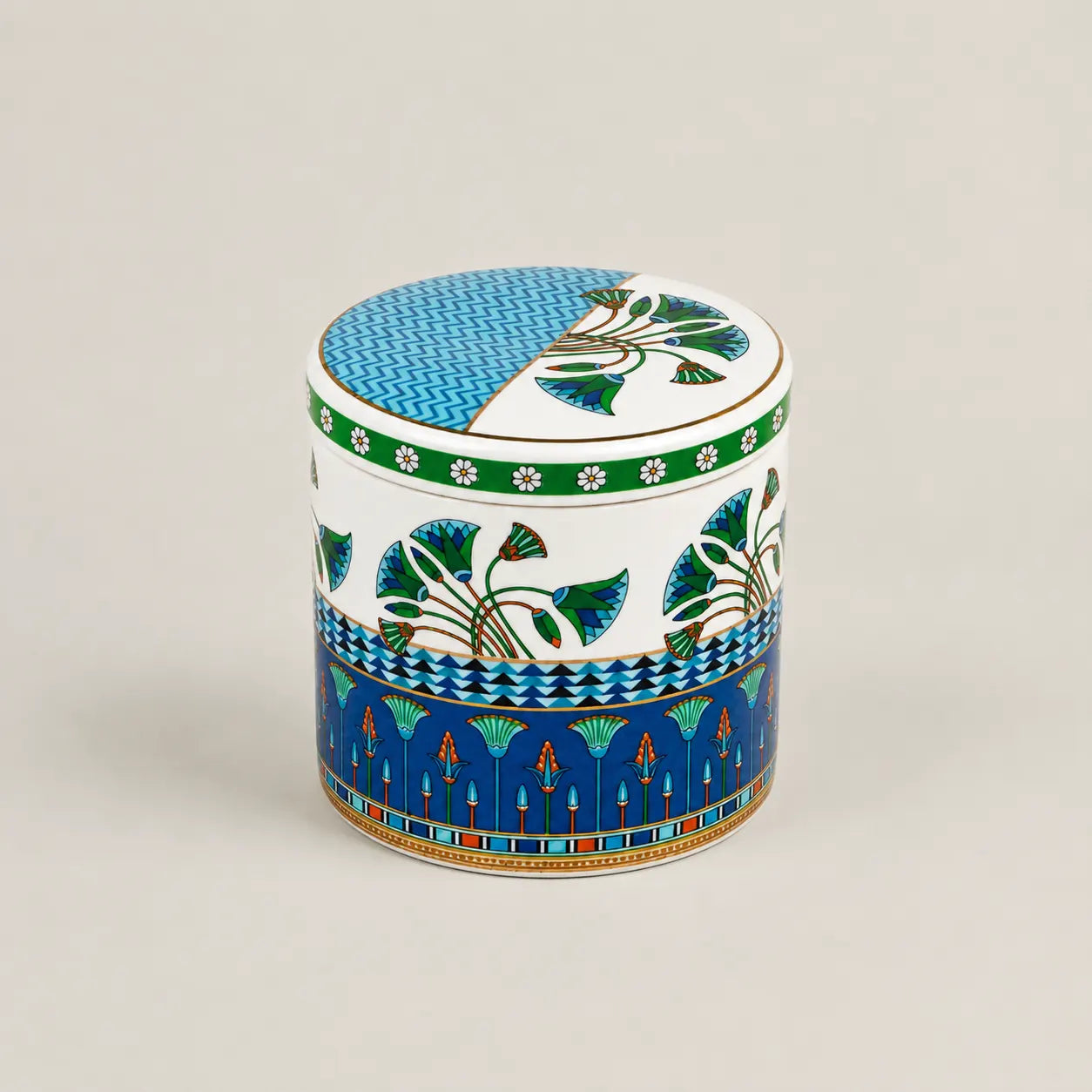 Luxury ceramic storage jar with a secure lid featuring intricate blue waves and a green botanical design.