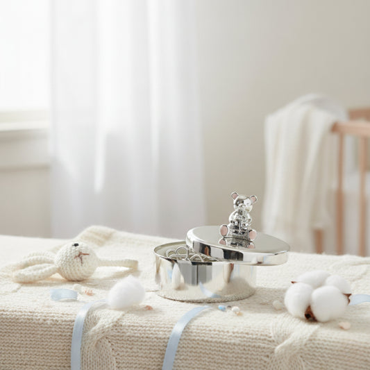 Silver baby keepsake trinket box with teddy bear design styled in nursery setting – perfect baby shower or christening gift