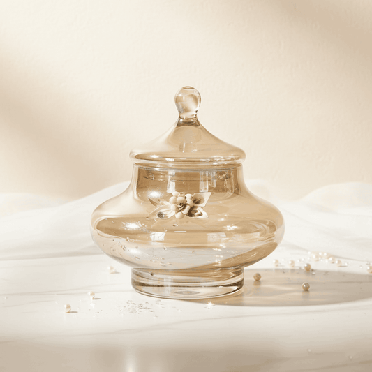 Splendor amber decorative jar by Fleur De Lis styled as luxury home décor, showcasing a lidded glass jar with floral detailing in an elegant setting.